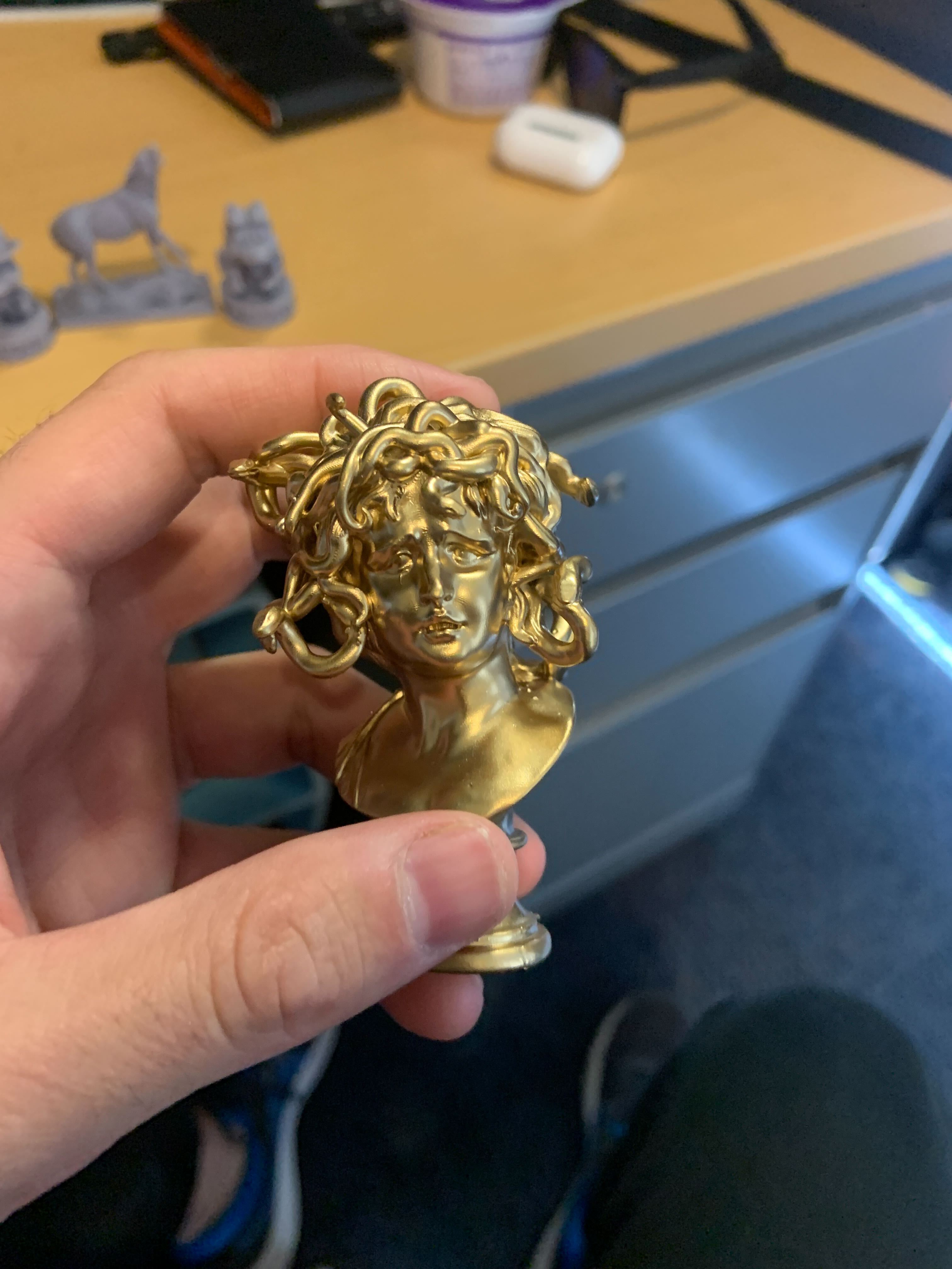Medusa statue spray painted gold